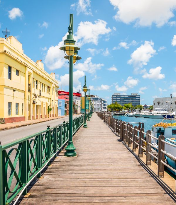 The bright and colourful waterfront of Bridgetown in Barbados is photographic worthy! Sherri Lavigne, owner and travel advisor at Have Sherri, Will Travel will help you experience all Barbados has to offer!