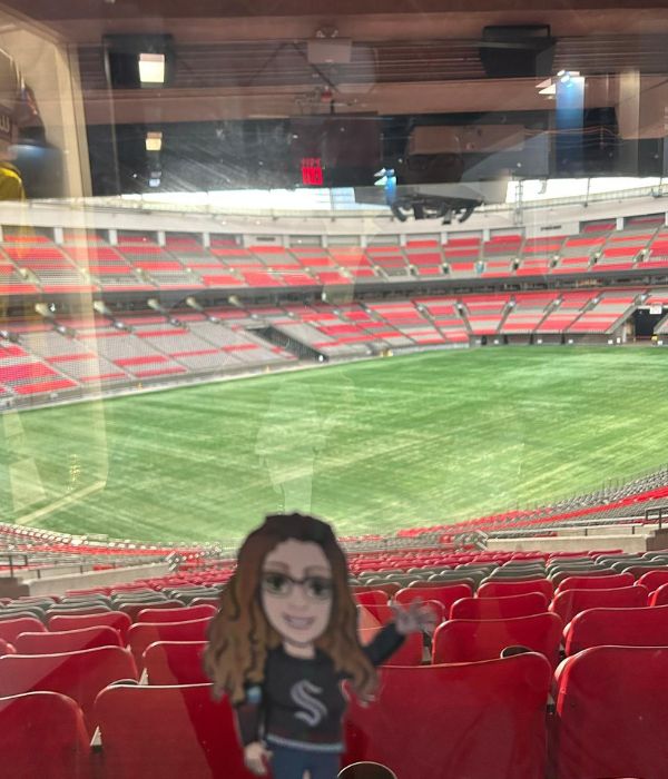 Mini Sherri attending an NHL game — before the ice is uncovered