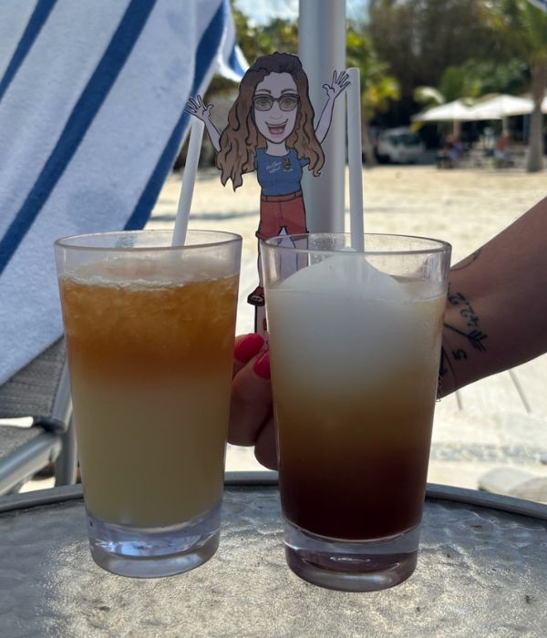 Mini Sherri in destination introducing client to pina colada
