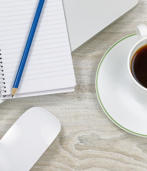computer mouse, coffee and note pad — always on the desk of Sherri Lavigne